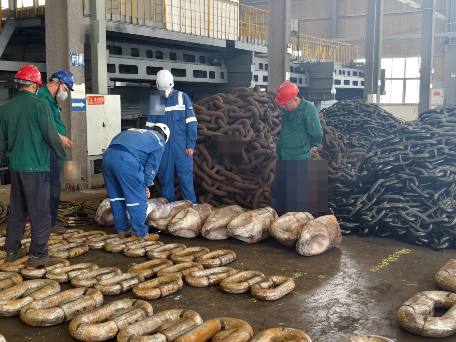 Mooring hardware laid out for dimensional inspection